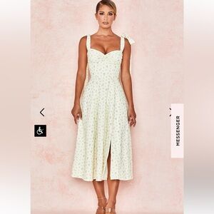 Light yellow summer dress with flowers from house of CB Never worn without tags.